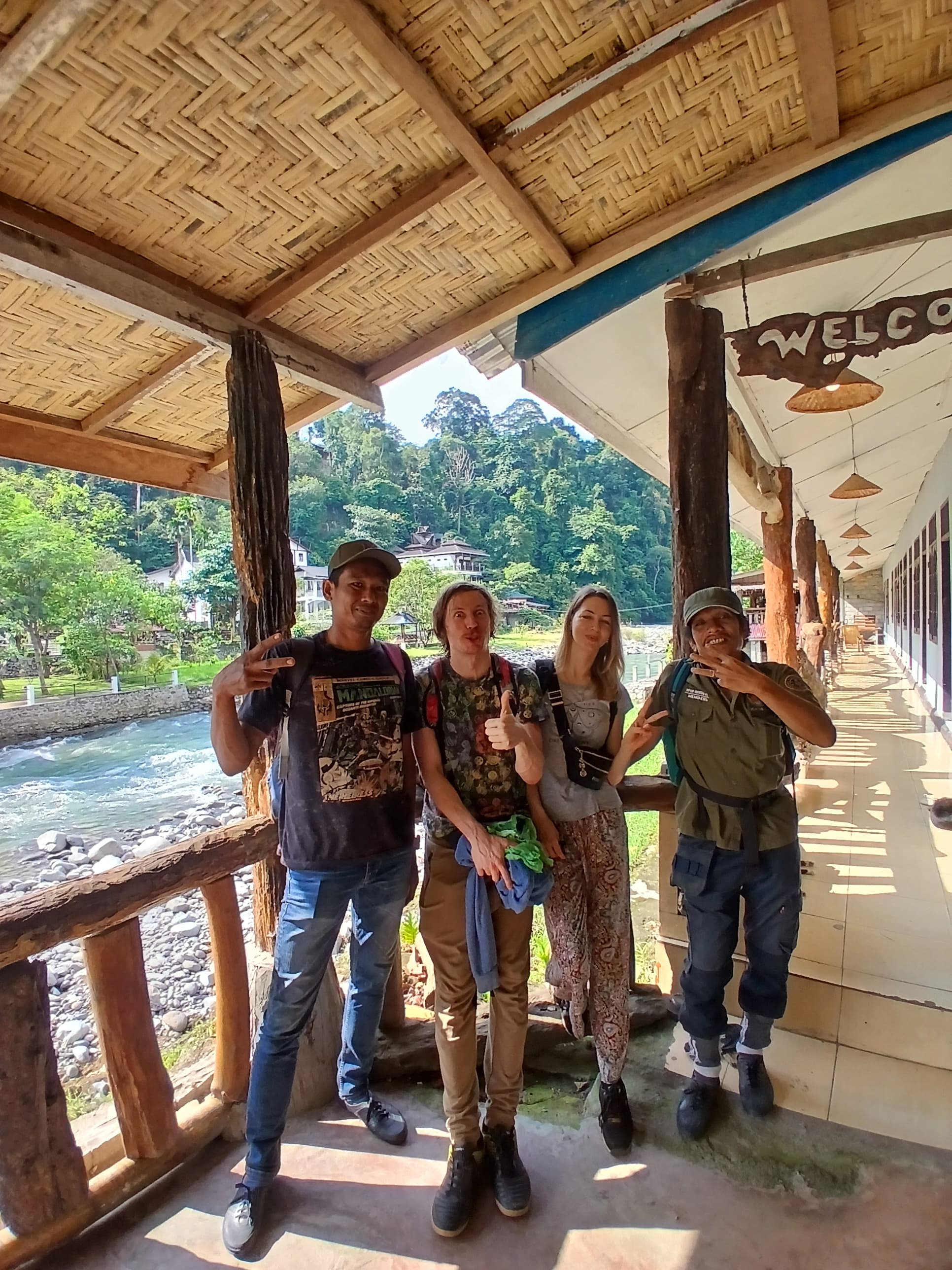 Happy tourists with guide at Bukit Lawang